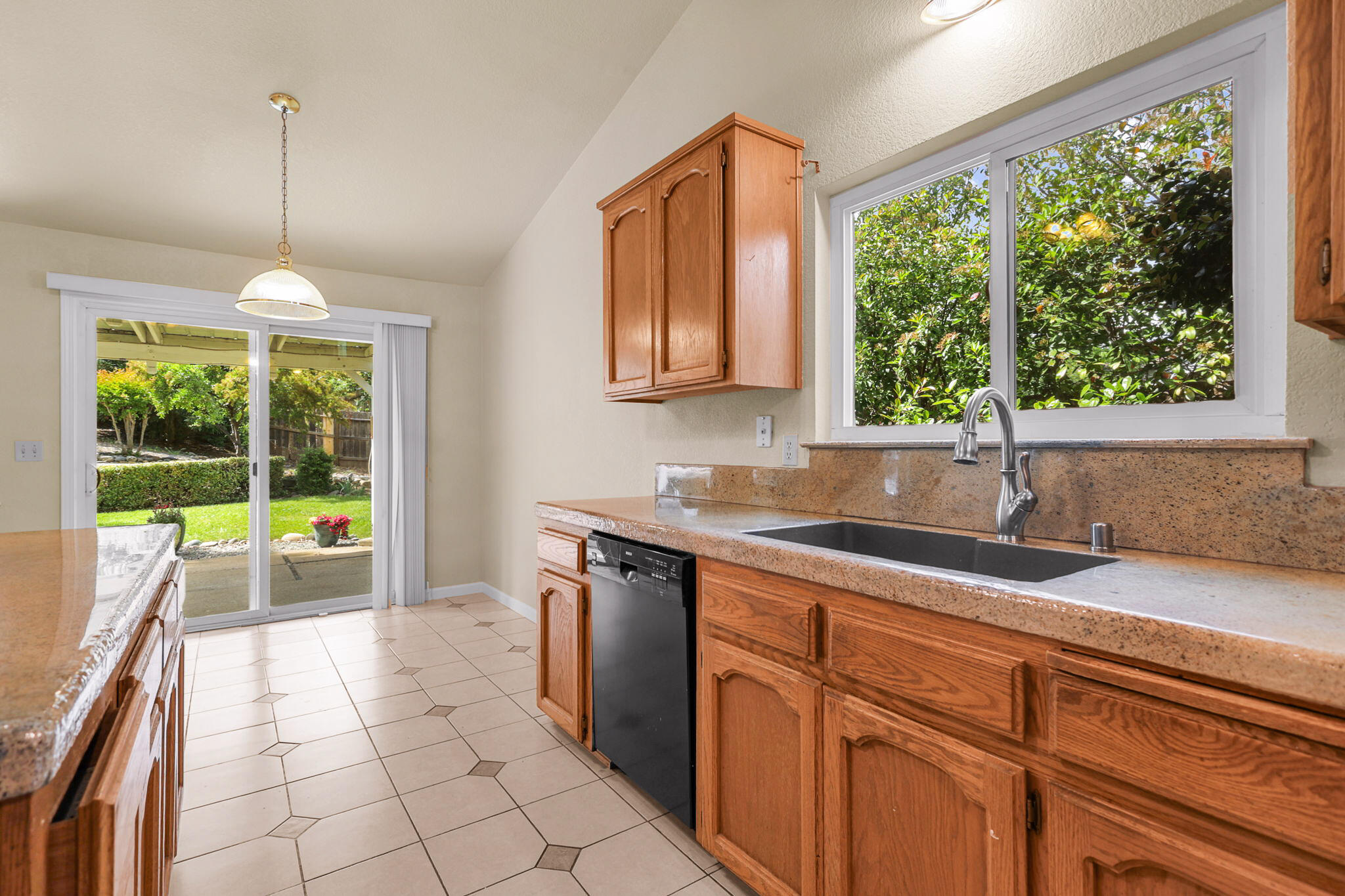 550 Vansicklen Way Redding, CA 96003 - Photo 20 of 52 kitchen to backyard
