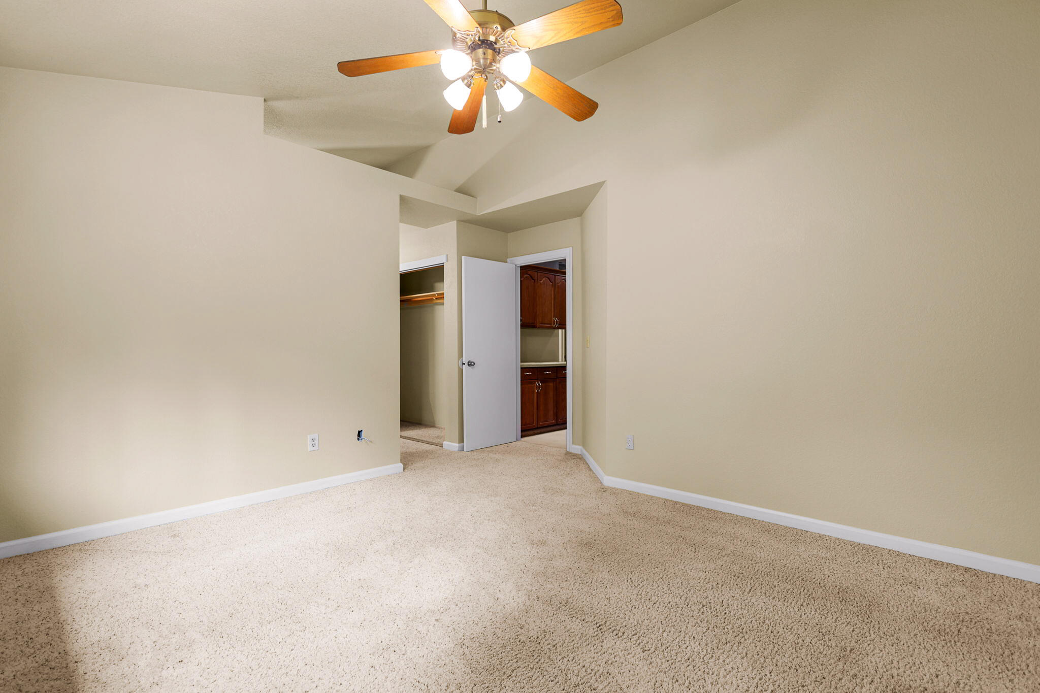 550 Vansicklen Way Redding, CA 96003 - Photo 28 of 52 an empty room with closet and a chandelier fan