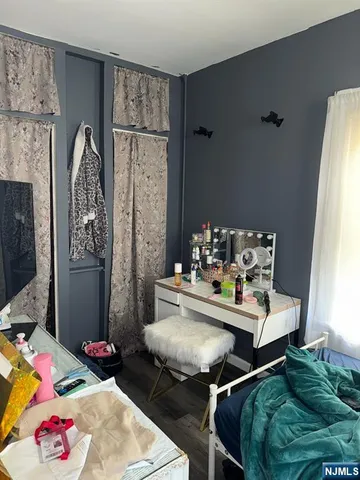 a view of a dining room with furniture and a chandelier