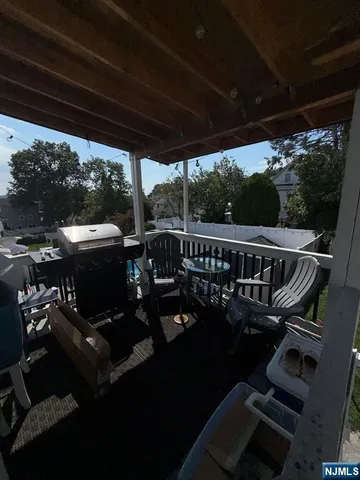 a view of a balcony with chairs