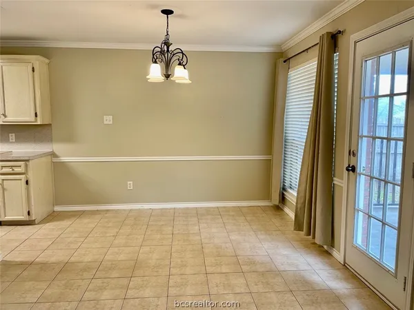 a view of a room with a window and brick walls