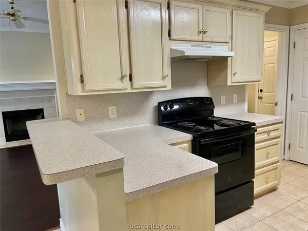 a view of a room with a fan and a fan