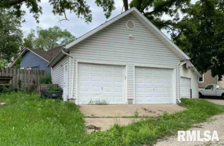 813 West 2nd Street Cedar Falls, IA 50613 - Photo 3 of 3 a front view of a house with a yard and garage