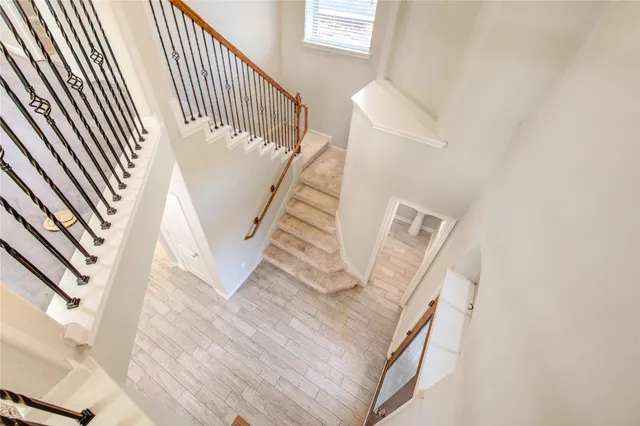 a view of a livingroom with a ceiling fan and window