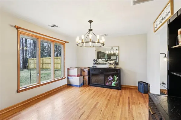 a living room with fireplace furniture and a flat screen tv
