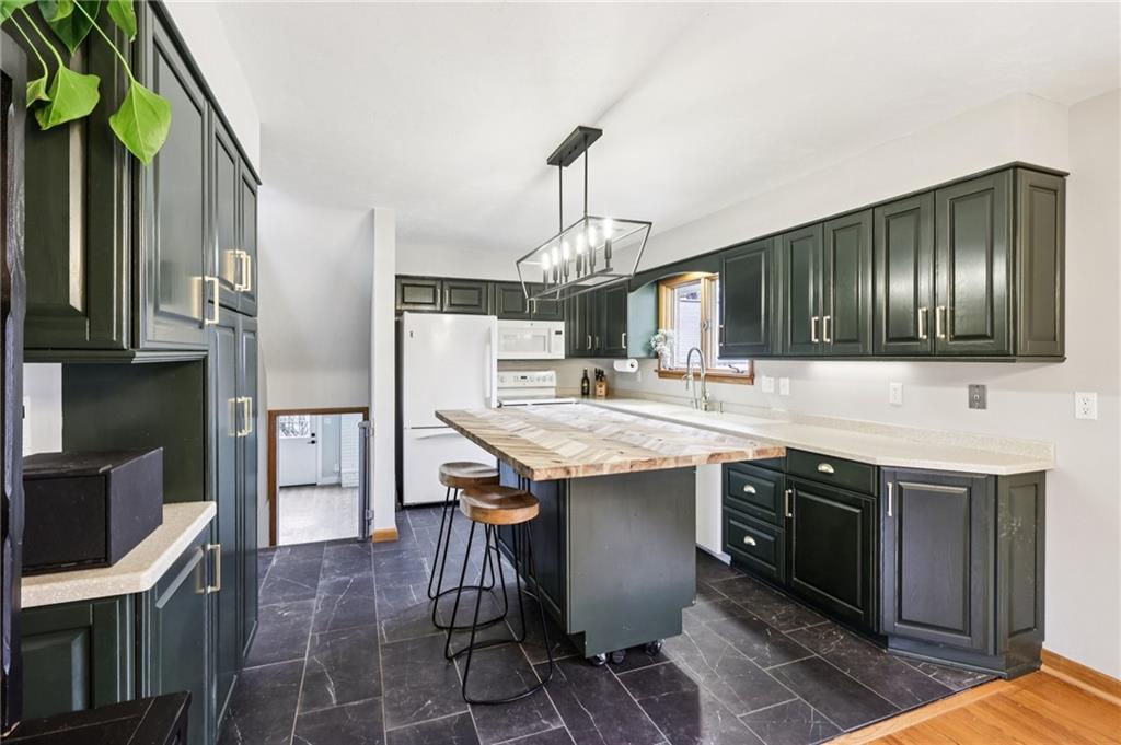 862 White Farm Road Indiana, PA 15701 - Photo 16 of 49 a kitchen with stainless steel appliances granite countertop a sink a stove and a refrigerator