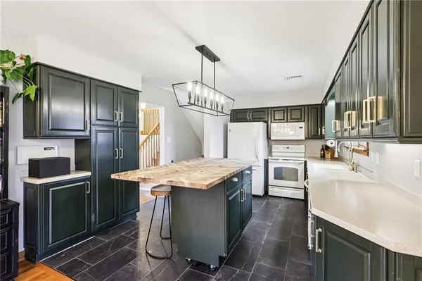 a kitchen with counter top space cabinets and stainless steel appliances