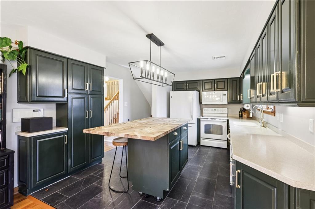 862 White Farm Road Indiana, PA 15701 - Photo 17 of 49 a kitchen with counter top space cabinets and stainless steel appliances
