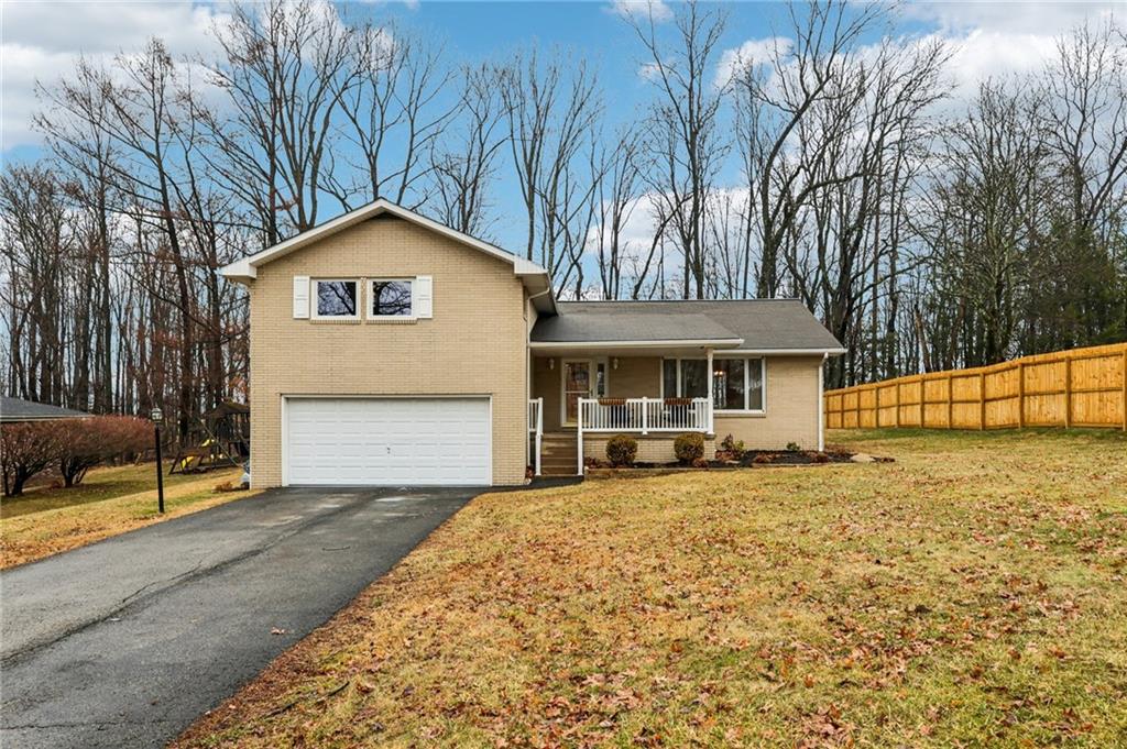 862 White Farm Road Indiana, PA 15701 - Photo 2 of 49 a front view of a house with a yard and garage