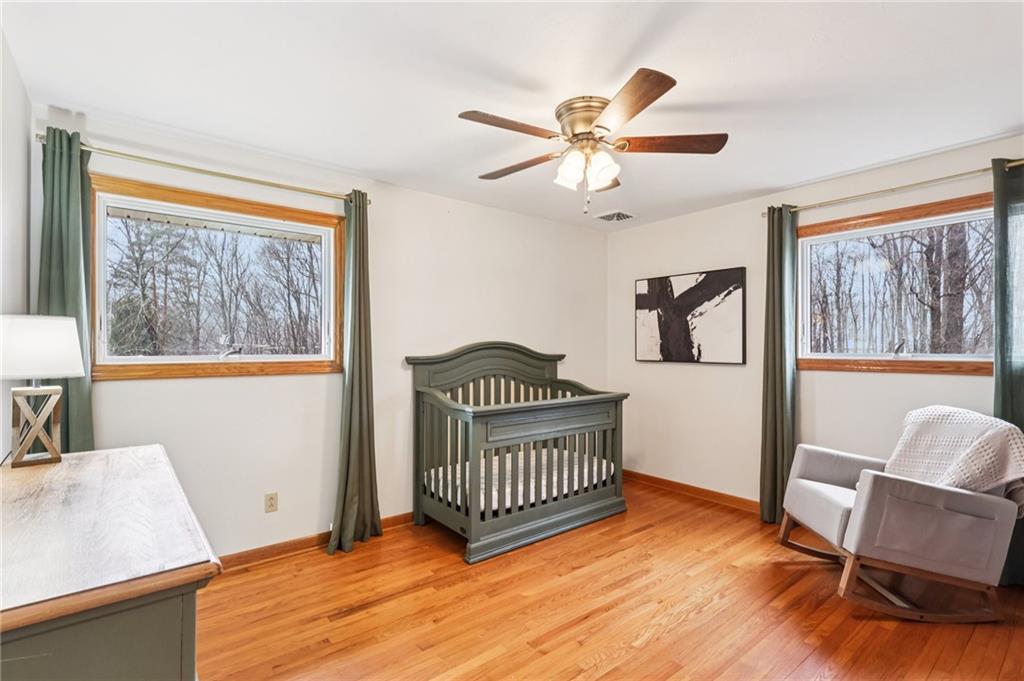 862 White Farm Road Indiana, PA 15701 - Photo 22 of 49 a view of a hallway with wooden floor and a ceiling fan