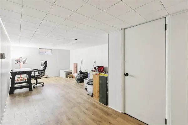 a view of a livingroom with furniture and a window
