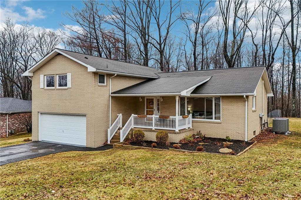 862 White Farm Road Indiana, PA 15701 - Photo 45 of 49 a front view of a house with a yard and garage