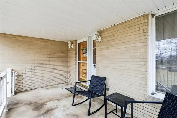 a view of chair and table in the patio