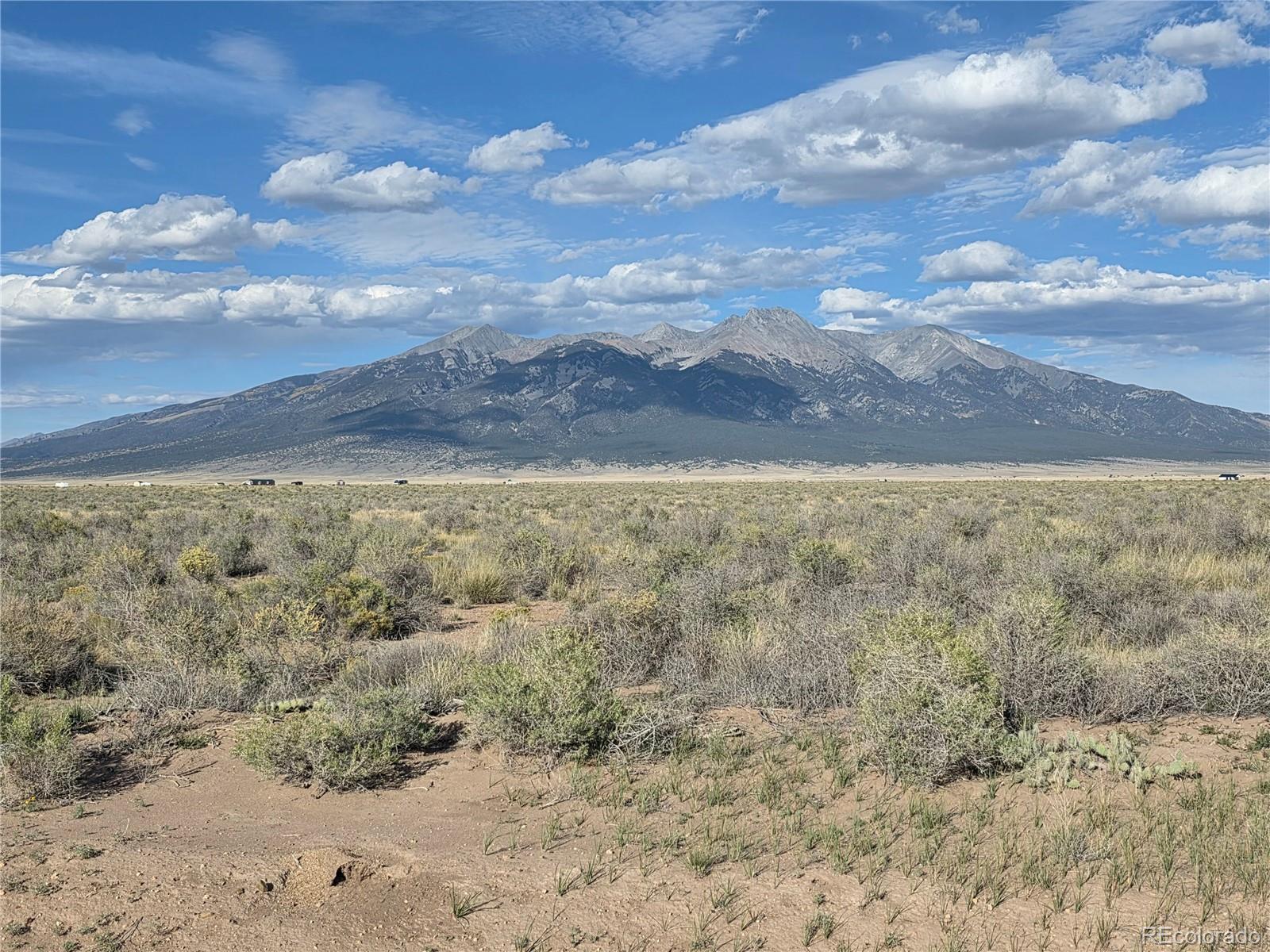 Lot 7 Gold Road Alamosa, CO 81101 - Photo 1 of 10 a view of yard with mountain and trees in the background