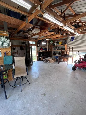 a view of a garage with cars