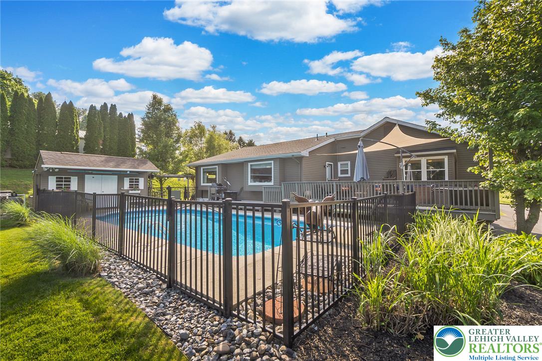 540 Briar Road Pen Argyl, PA 18072 - Photo 4 of 66 An inviting pool, secured with a sturdy fence, creates a private oasis just steps from the house.