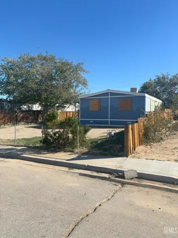 a view of a house with a street