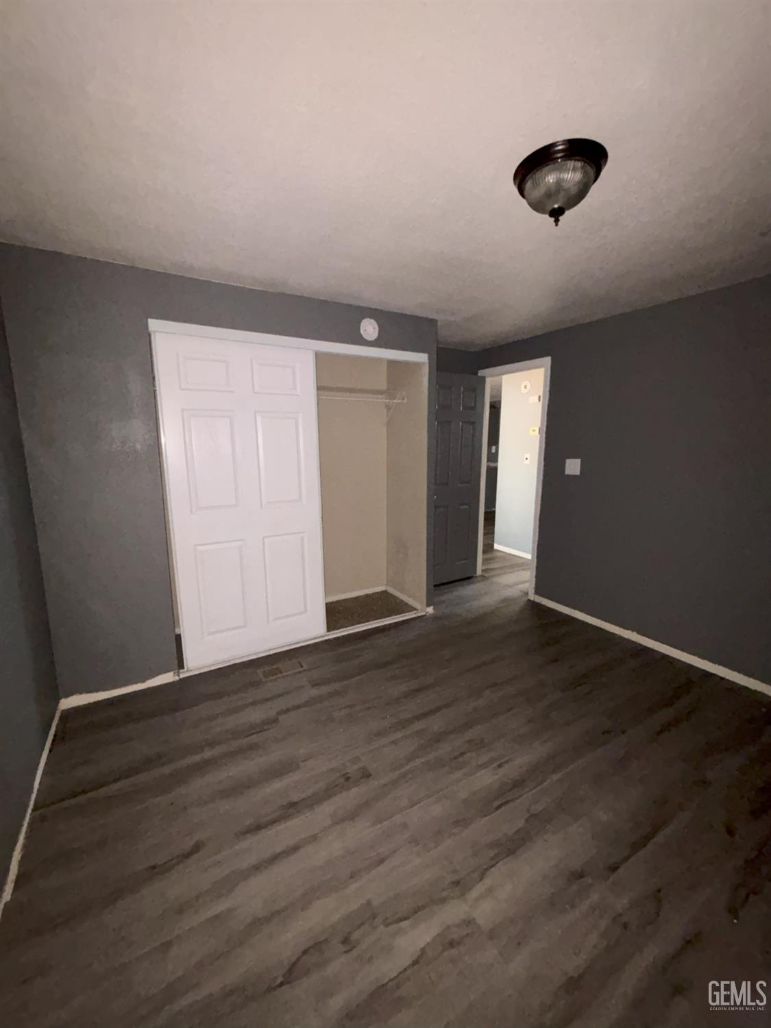 Undisclosed Address Ridgecrest, CA 93555 - Photo 21 of 27 a view of an empty room with wooden floor