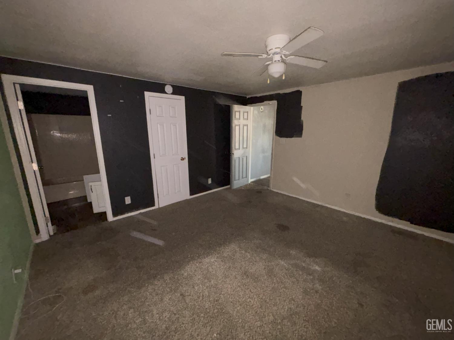 Undisclosed Address Ridgecrest, CA 93555 - Photo 23 of 27 a view of a hallway with a chandelier fan