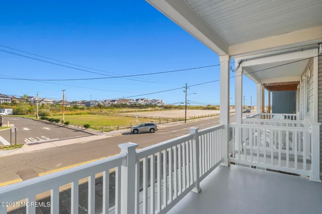 a view of a balcony with an ocean view