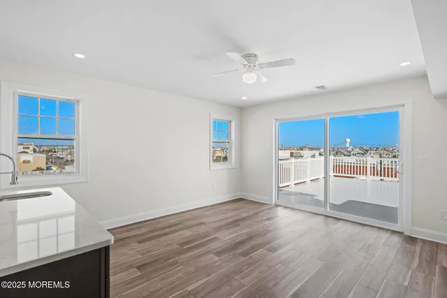 a view of a kitchen with a dishwasher cabinet and a fireplace