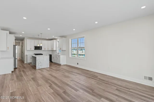 a view of kitchen with wooden floor