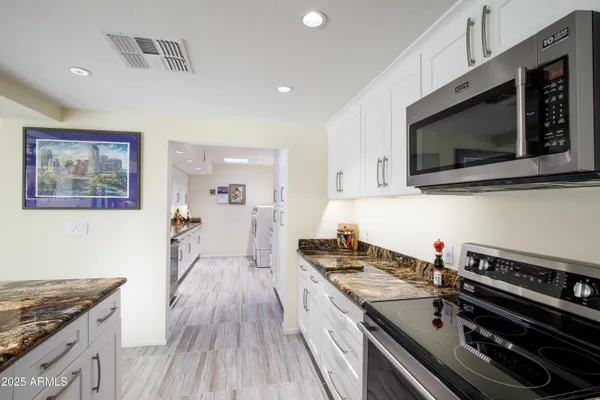 a kitchen with a stove and a microwave