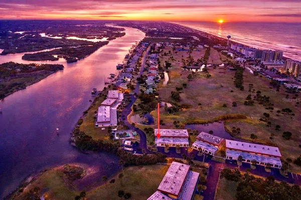 a view of a swimming pool with lounge chairs