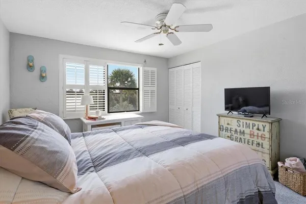 a view of city from a balcony with furniture