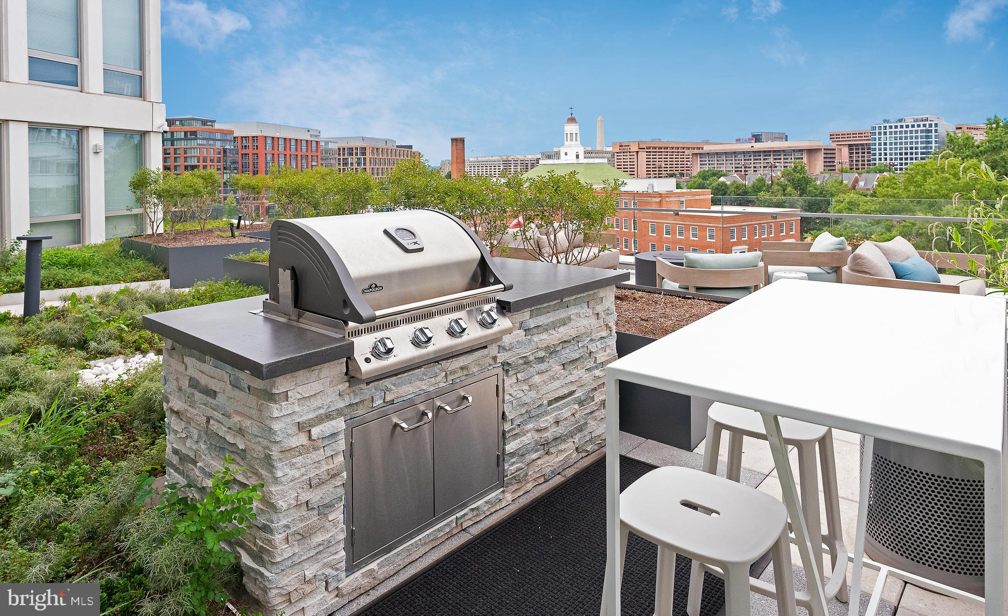 900 7th Street Southwest, Unit PH04 Washington, DC 20024 - Photo 11 of 25 a view of a chairs and table in patio