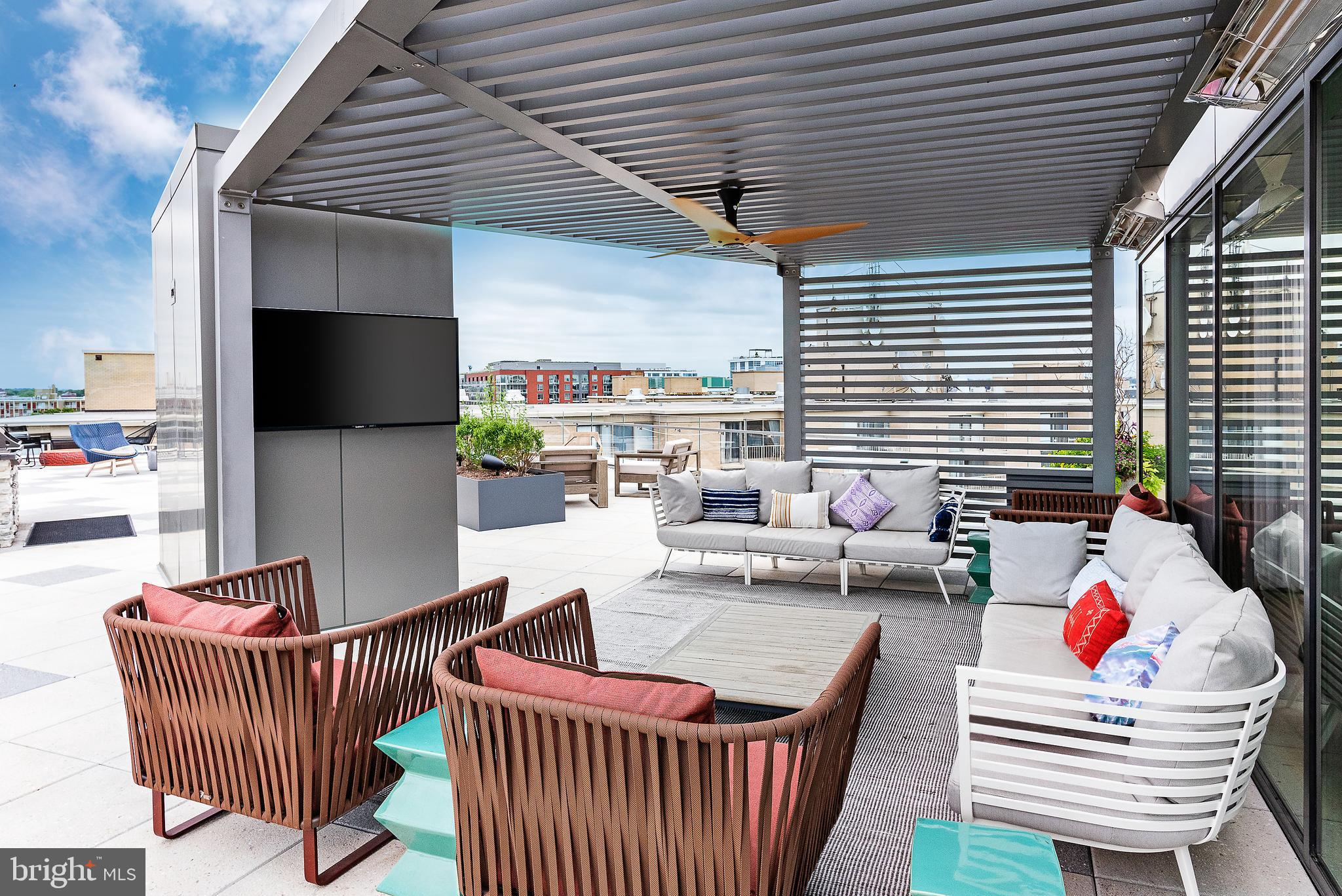 900 7th Street Southwest, Unit PH04 Washington, DC 20024 - Photo 12 of 25 a outdoor space with patio furniture and a potted plant