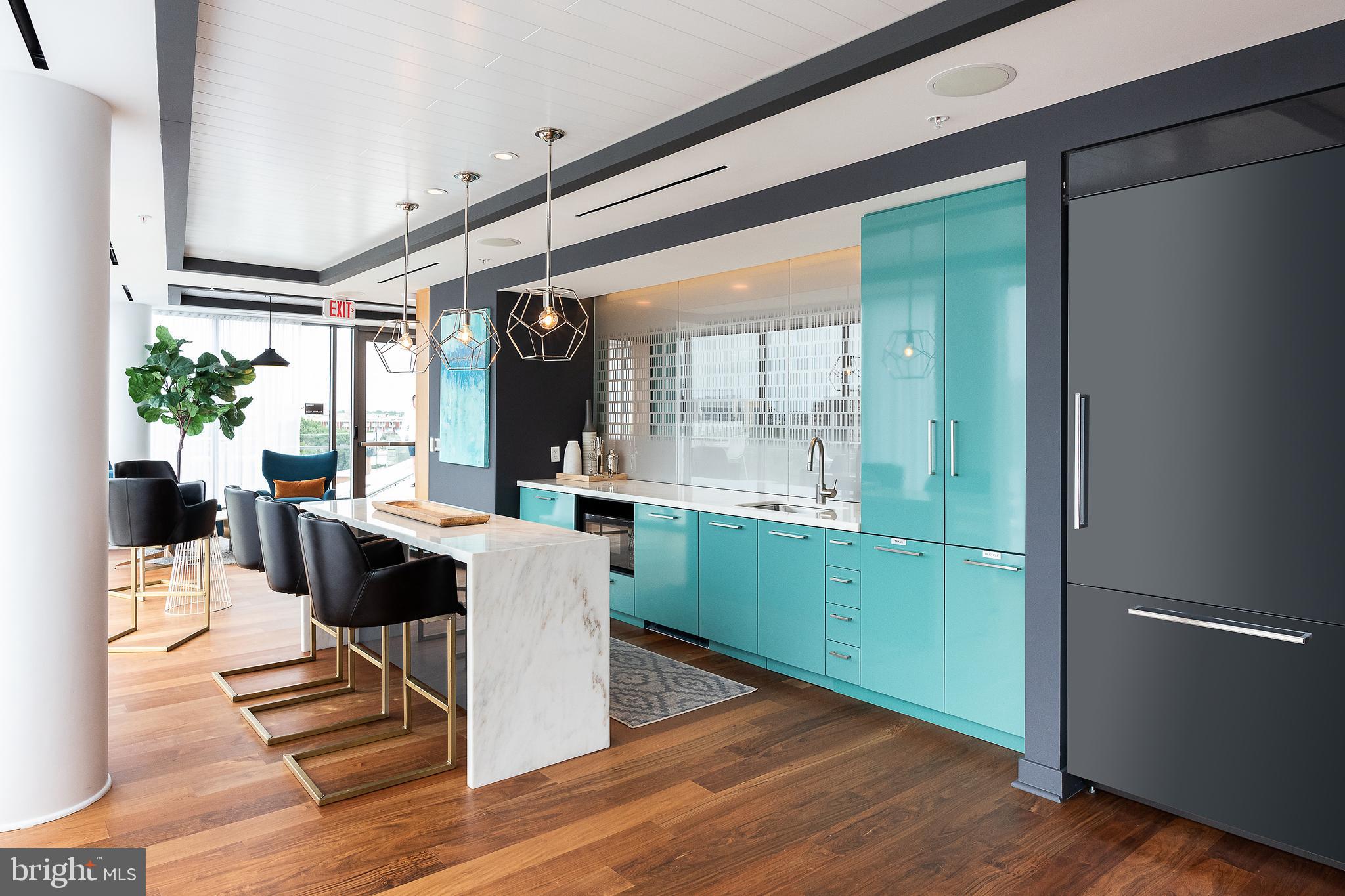 900 7th Street Southwest, Unit PH04 Washington, DC 20024 - Photo 18 of 25 a living room with furniture and a large window