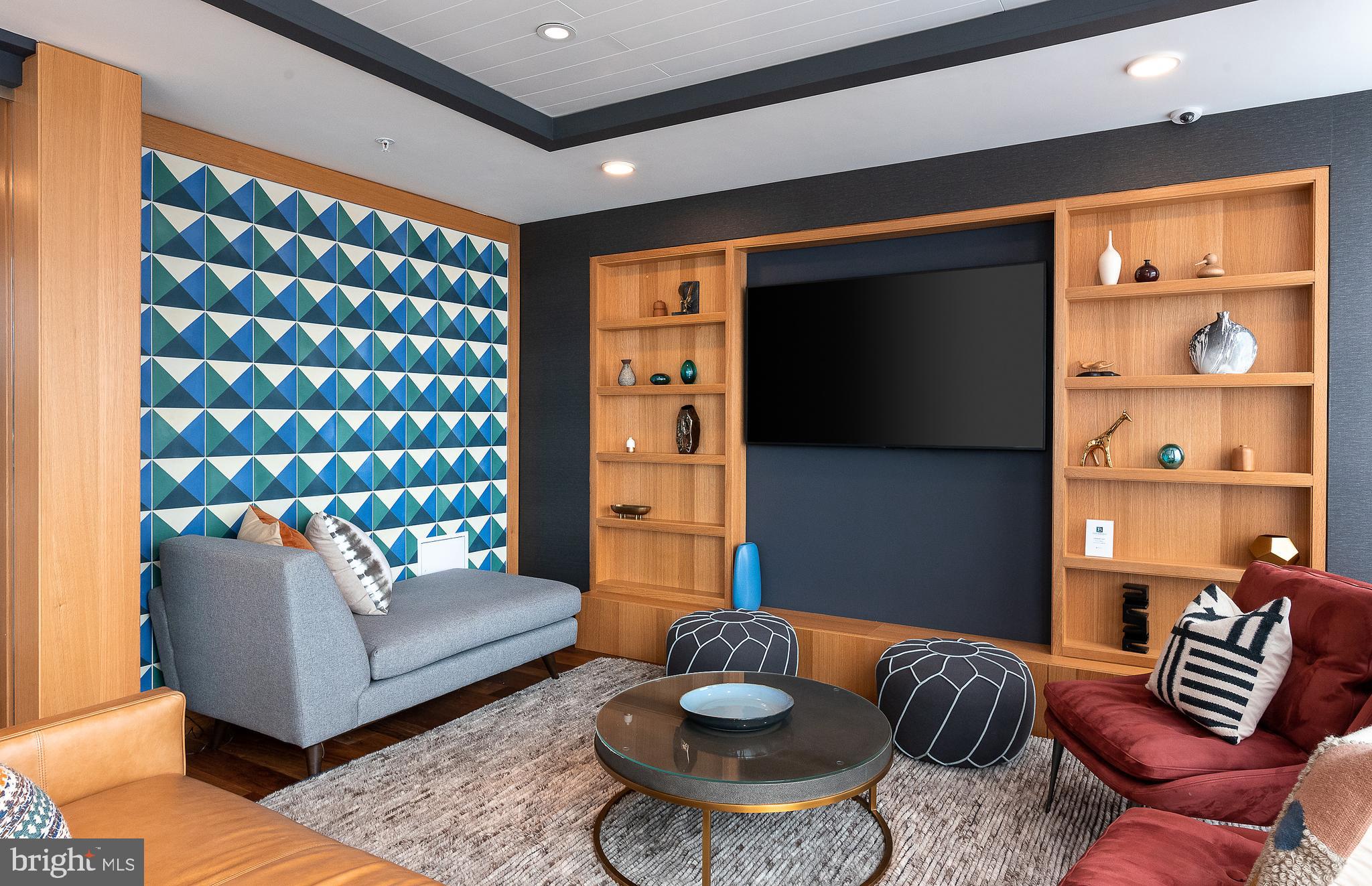 900 7th Street Southwest, Unit PH04 Washington, DC 20024 - Photo 19 of 25 a living room with furniture and wooden floor