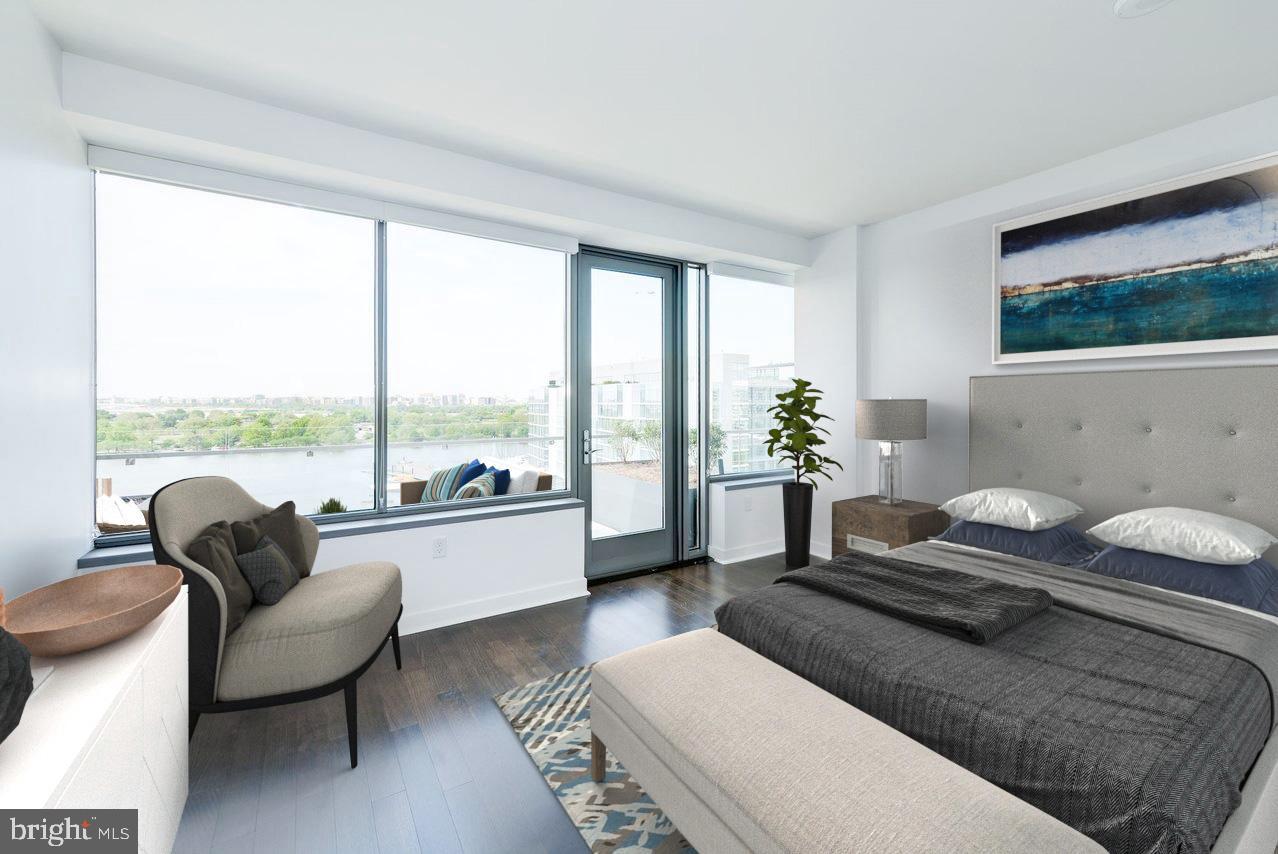 900 7th Street Southwest, Unit PH04 Washington, DC 20024 - Photo 3 of 25 a living room with furniture and a large window