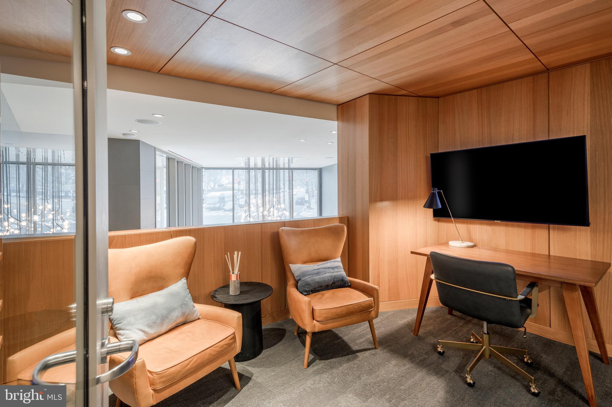900 7th Street Southwest, Unit PH04 Washington, DC 20024 - Photo 21 of 25 a living room with furniture and a flat screen tv