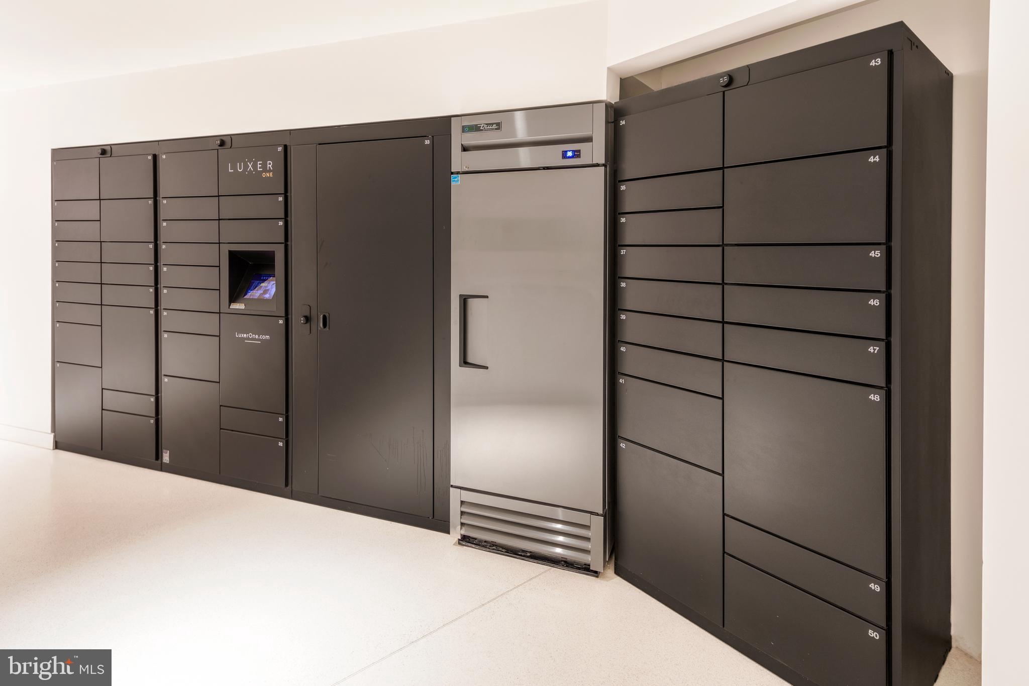 900 7th Street Southwest, Unit PH04 Washington, DC 20024 - Photo 25 of 25 a kitchen with stainless steel appliances and refrigerator