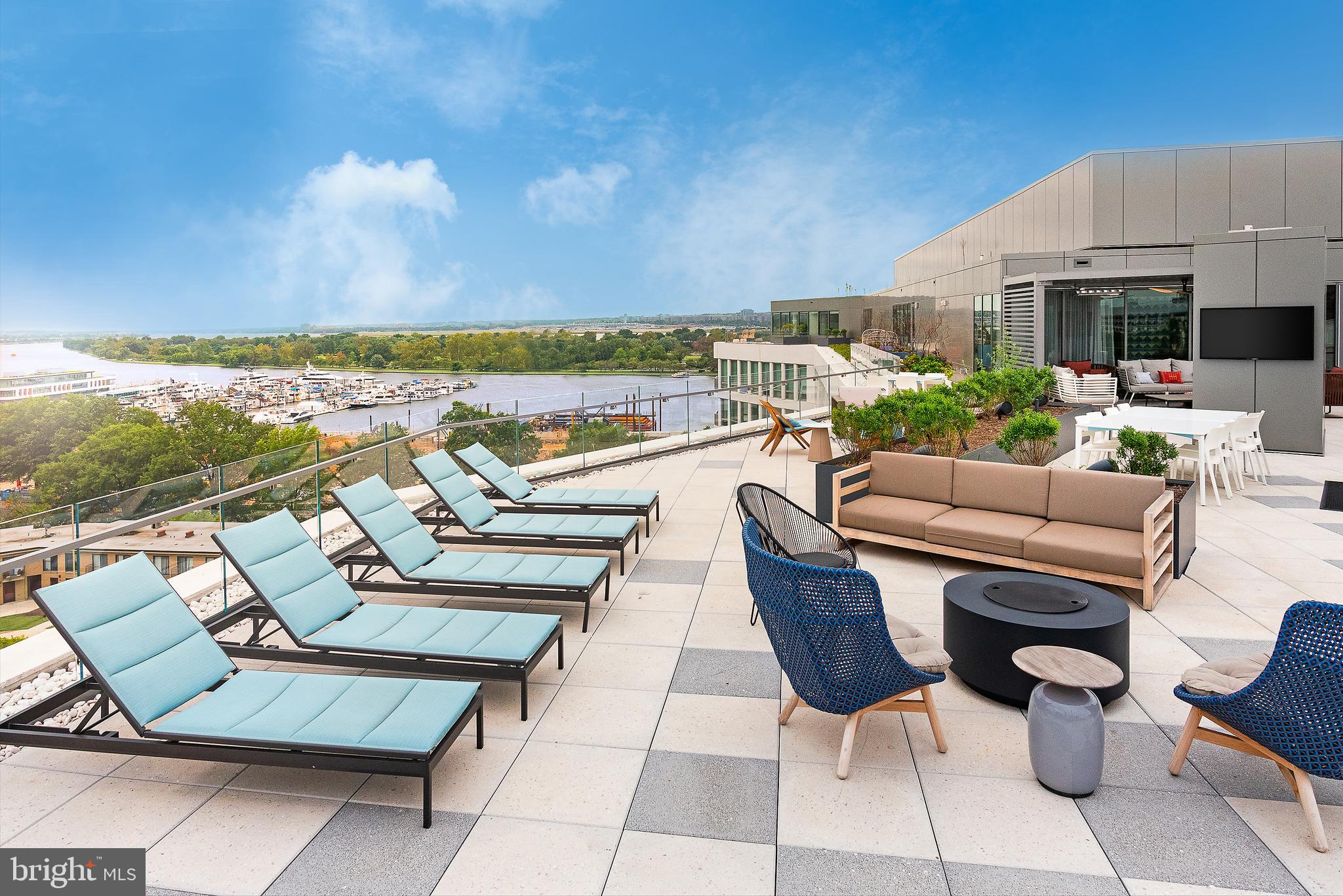 900 7th Street Southwest, Unit PH04 Washington, DC 20024 - Photo 7 of 25 a view of a terrace with furniture and a garden