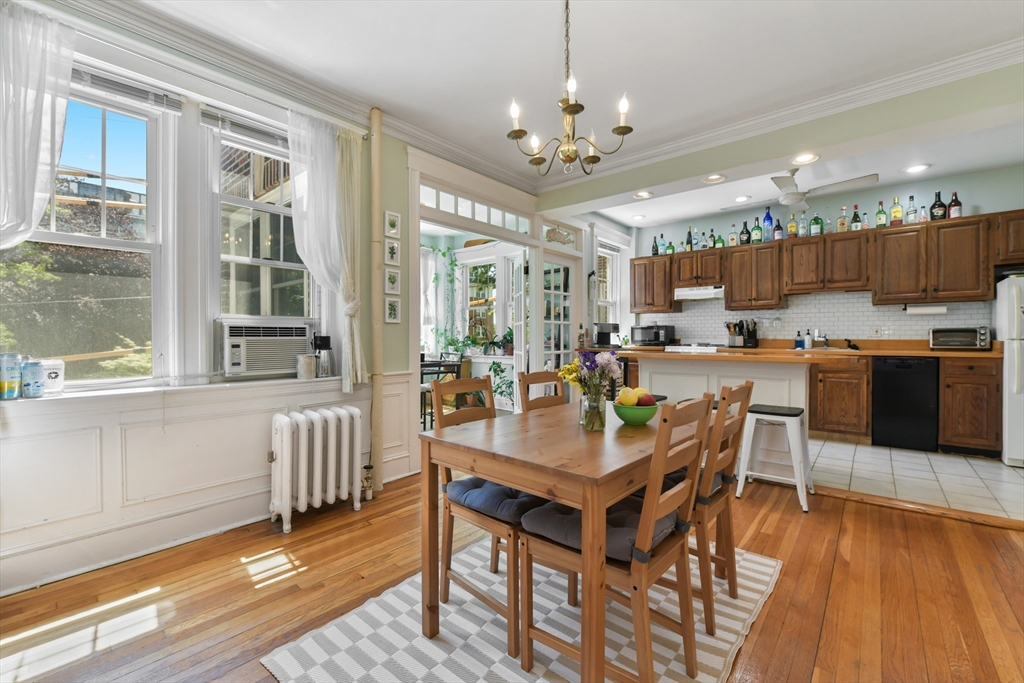 301 Allston Street, Unit 7 Boston, MA 02135 - Photo 11 of 25 a view of a dining room with furniture window and wooden floor