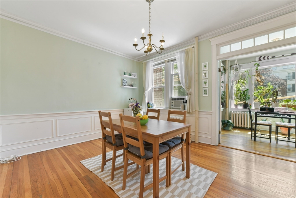 301 Allston Street, Unit 7 Boston, MA 02135 - Photo 12 of 25 a view of a dining room with furniture window and wooden floor