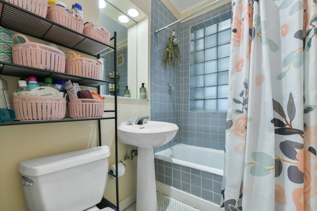 301 Allston Street, Unit 7 Boston, MA 02135 - Photo 16 of 25 a bathroom with a sink a toilet and shower