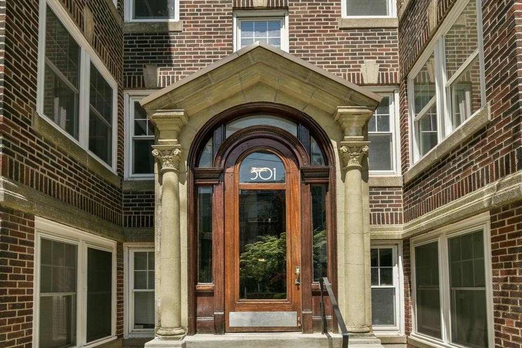 301 Allston Street, Unit 7 Boston, MA 02135 - Photo 21 of 25 a view of a brick house with large windows