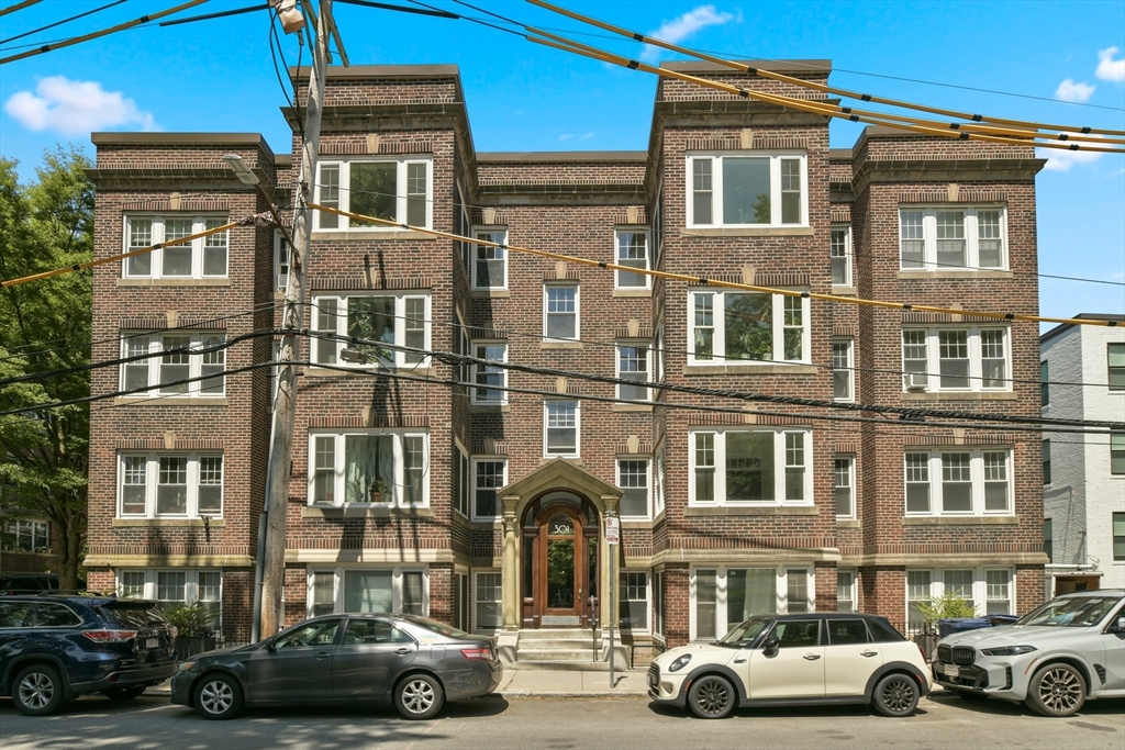 301 Allston Street, Unit 7 Boston, MA 02135 - Photo 22 of 25 a car parked in front of a building