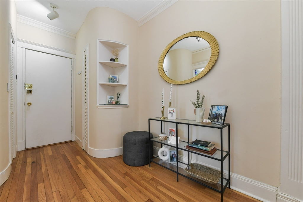 301 Allston Street, Unit 7 Boston, MA 02135 - Photo 3 of 25 a view of a room with wooden floor and furniture