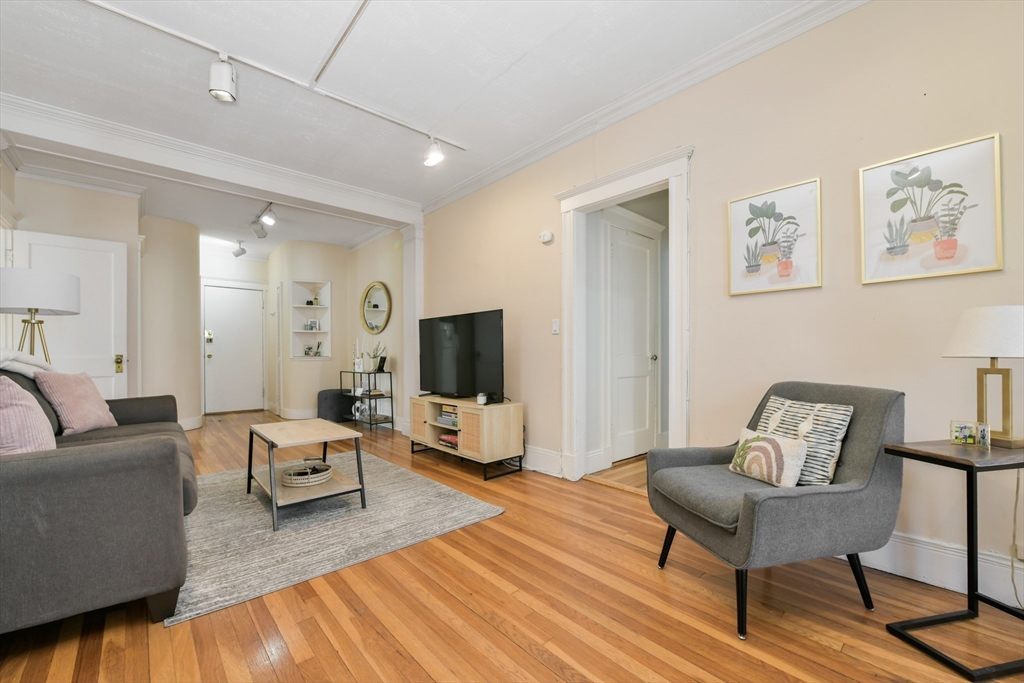 301 Allston Street, Unit 7 Boston, MA 02135 - Photo 6 of 25 a living room with furniture and a flat screen tv