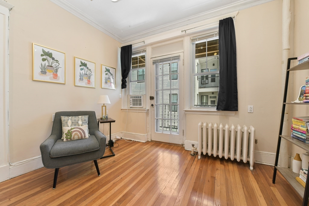 301 Allston Street, Unit 7 Boston, MA 02135 - Photo 7 of 25 a view of a livingroom with furniture and hardwood floor
