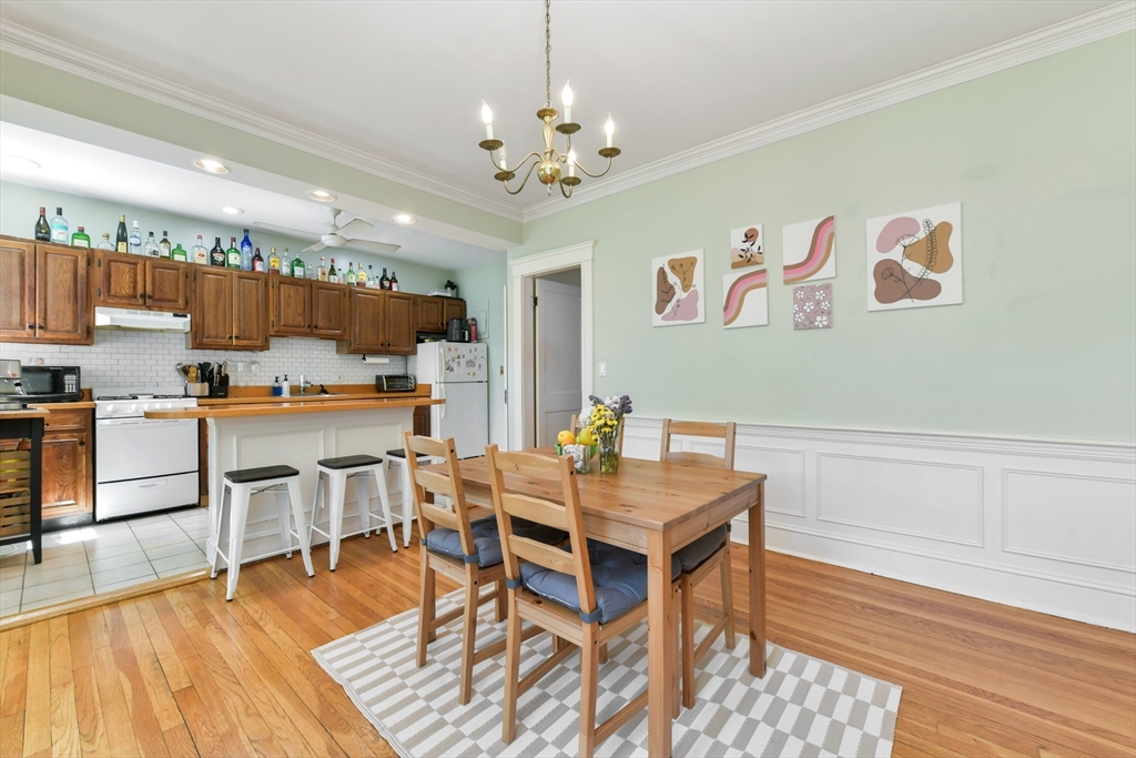 301 Allston Street, Unit 7 Boston, MA 02135 - Photo 10 of 25 a view of a dining room with furniture and wooden floor