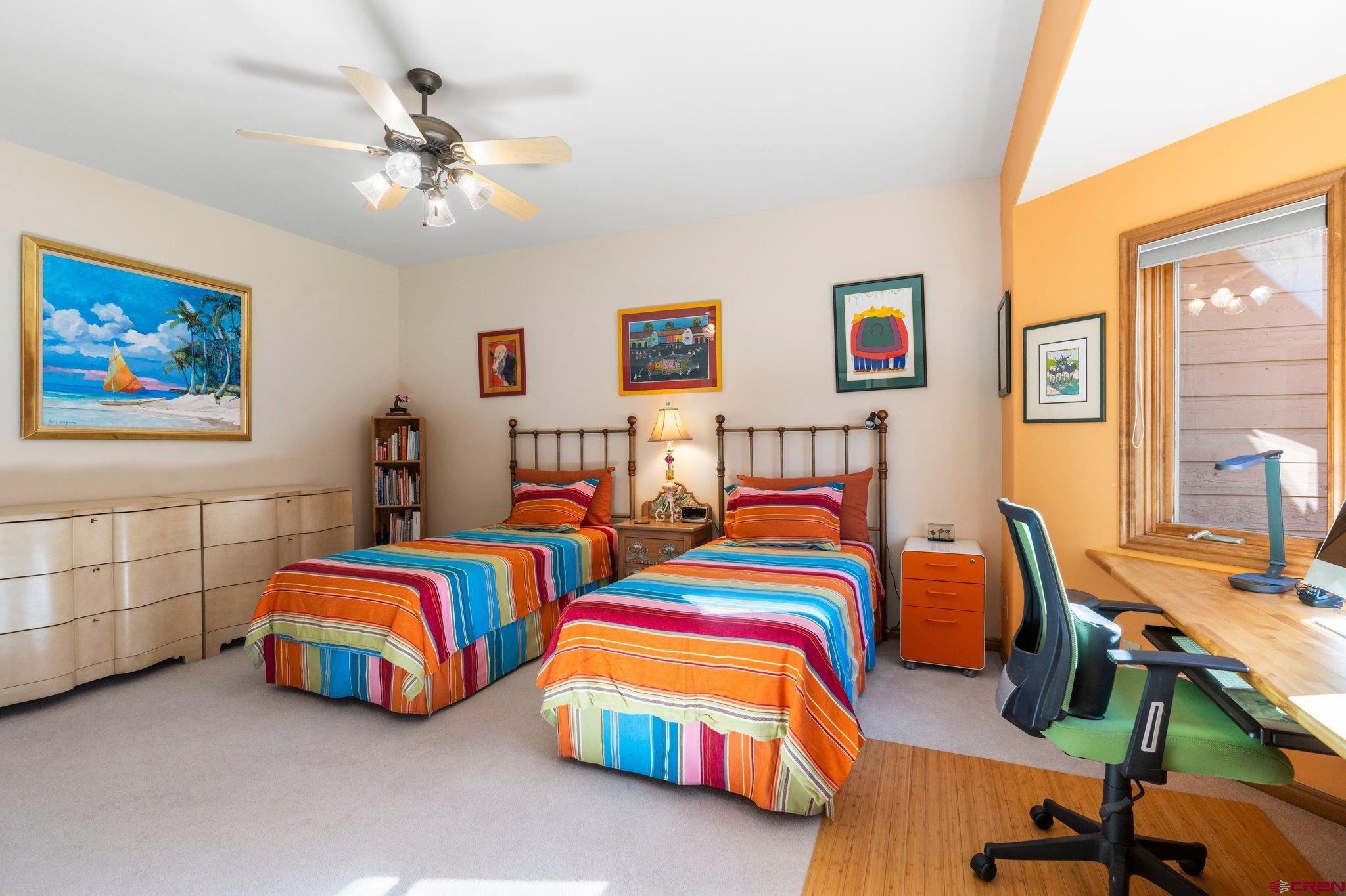 747 Oak Drive Durango, CO 81301 - Photo 16 of 34 a bedroom with two beds and a lamp on a dresser