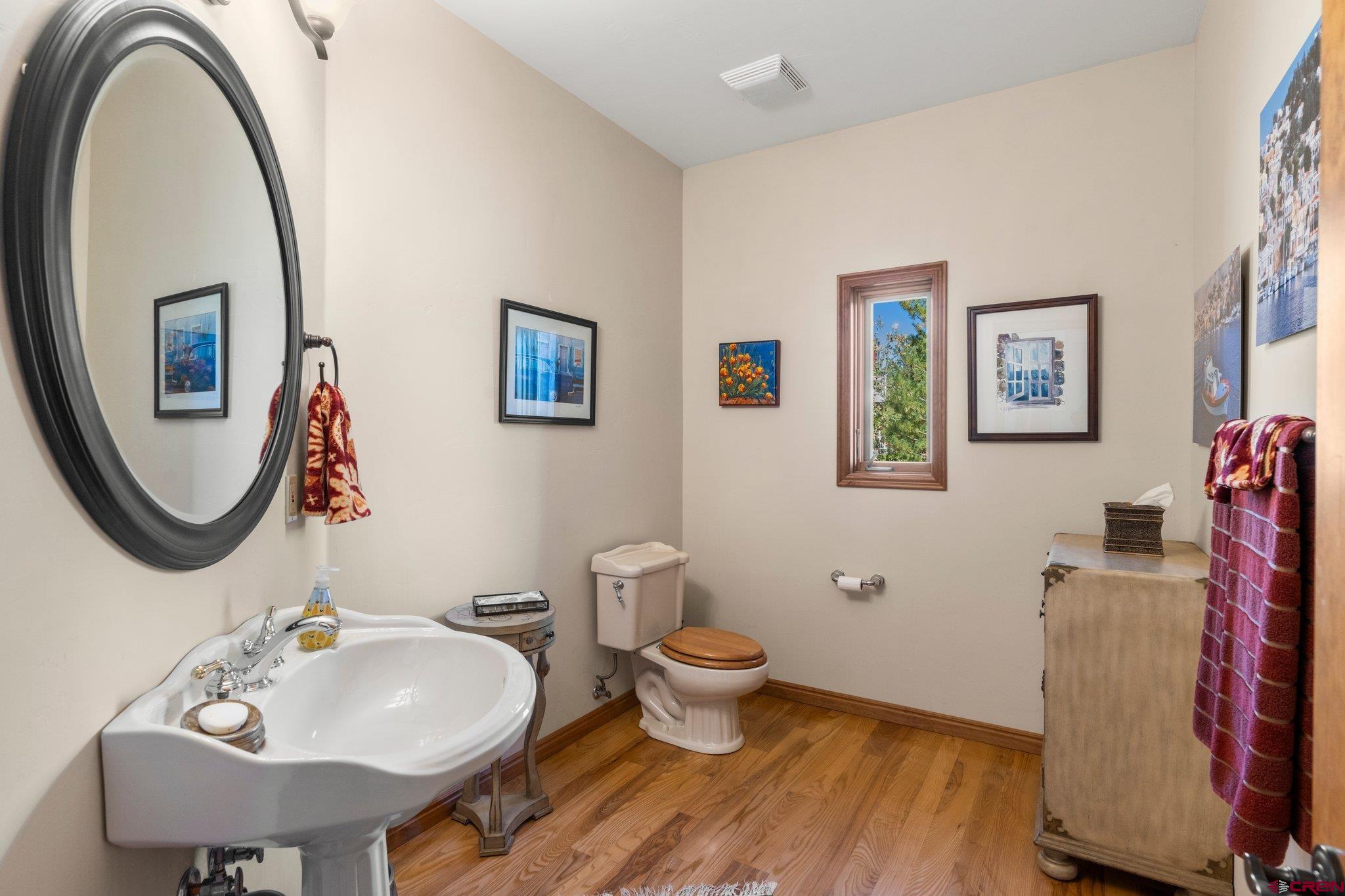 747 Oak Drive Durango, CO 81301 - Photo 23 of 34 a bathroom with a toilet sink and mirror