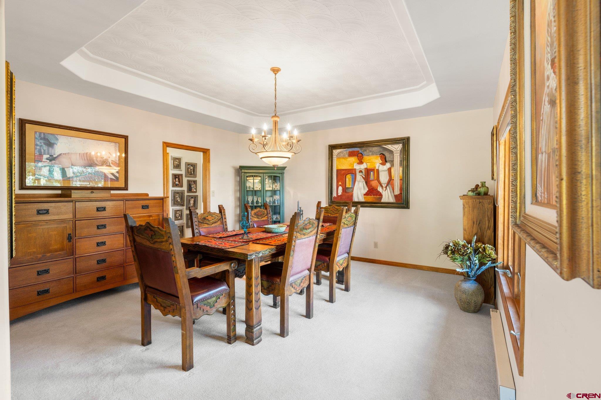 747 Oak Drive Durango, CO 81301 - Photo 25 of 34 a view of a dining room with furniture window and wooden floor