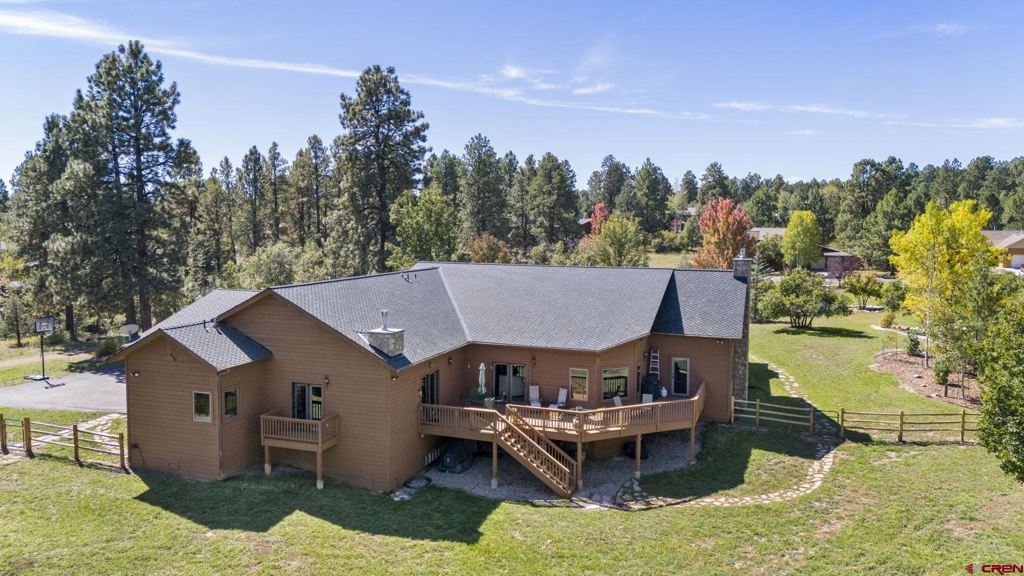 747 Oak Drive Durango, CO 81301 - Photo 30 of 34 a view of a house with a yard and sitting area